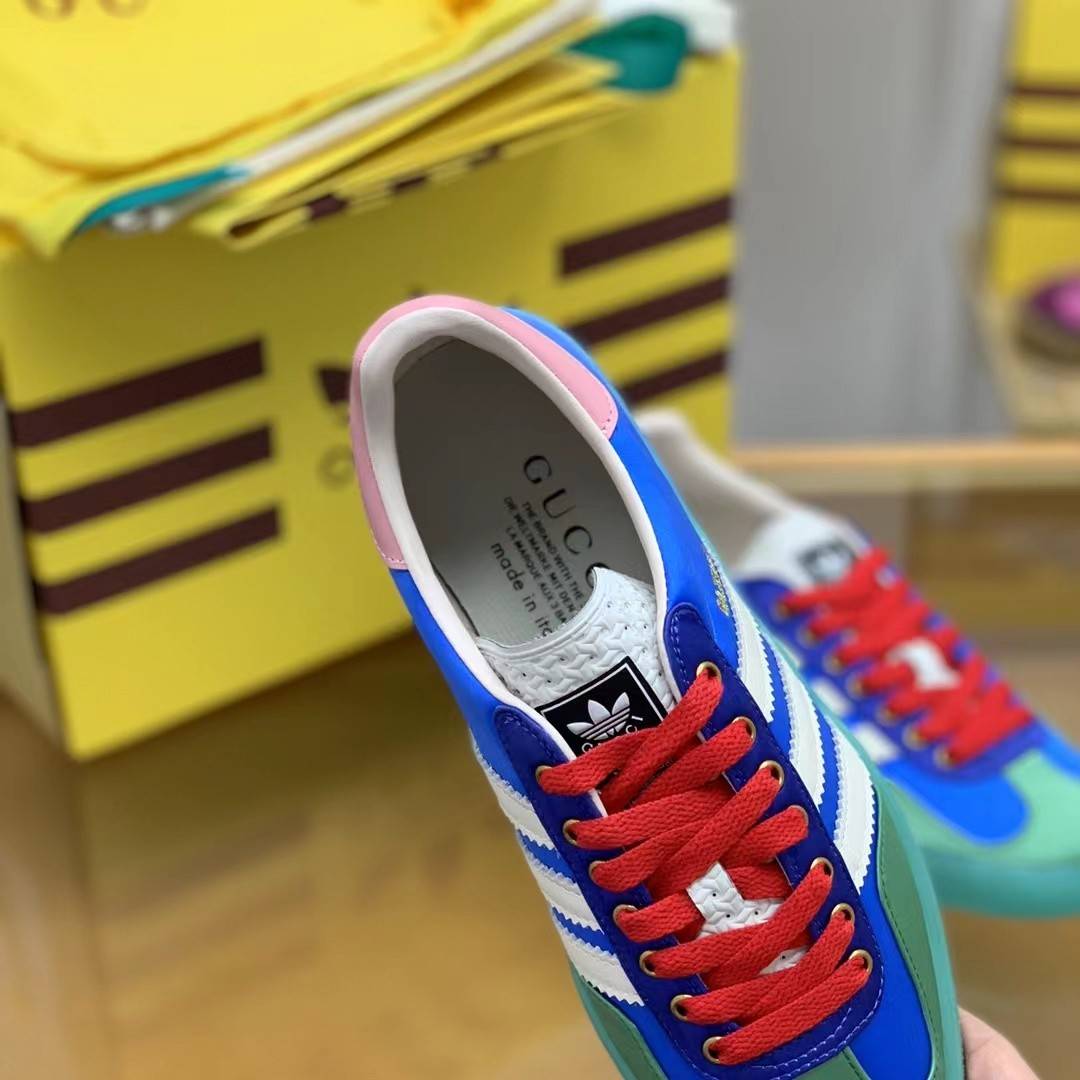 GU*I× Adidas sneakers