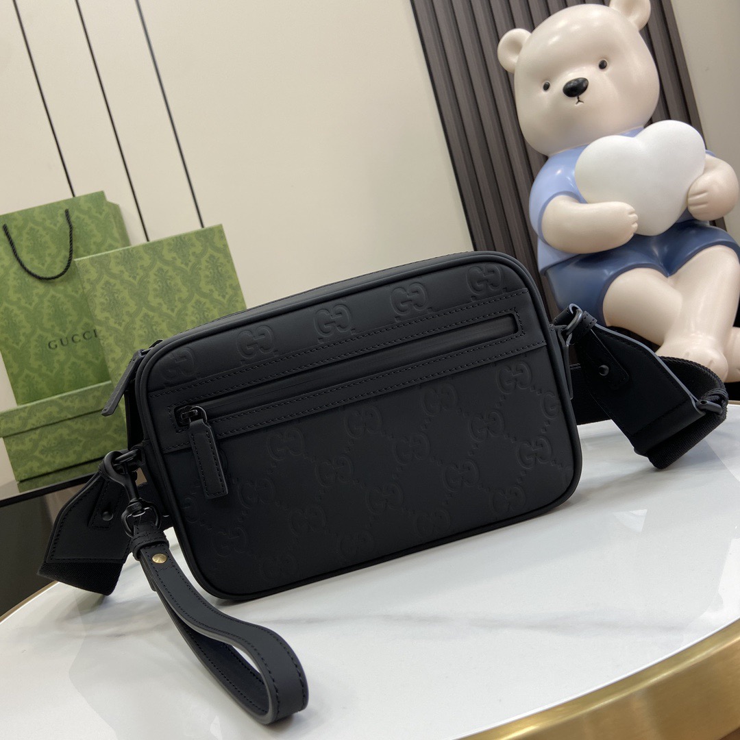 G*u*i crossbody bags a range of men''s bags in black rubber effect leather model: 771293. dimensions: 17* 24* 5cm
