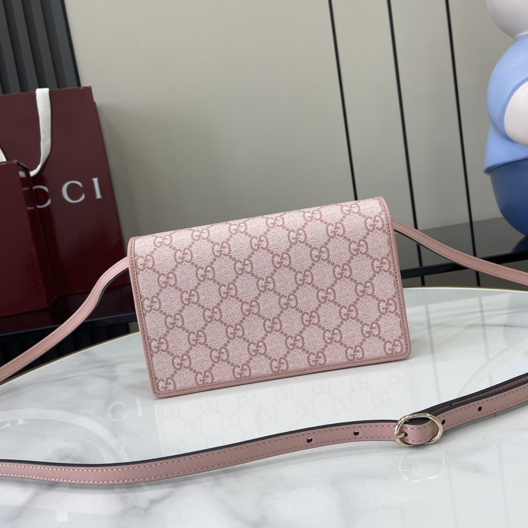 G*u*i emblem handbag